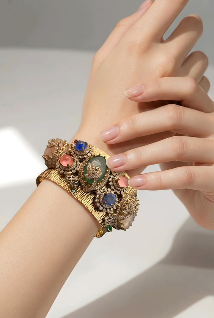 Gold textured ethnic cuff bracelet with coloured stones and AD detailing in traditional designer style