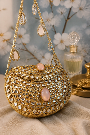 Luxury Noor Mirror Mini Bag with crystal embellishments, mirror detailing, pink stone accents, and gold chain sling design
