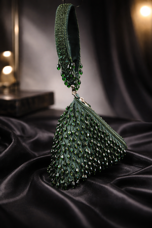Luxury green beaded wristlet bag with intricate handcrafted beadwork and contemporary triangular design
