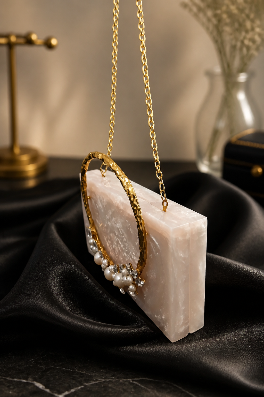 Luxury crystal bunch handle bag with pearl and crystal embellished gold handle and marble finish clutch body