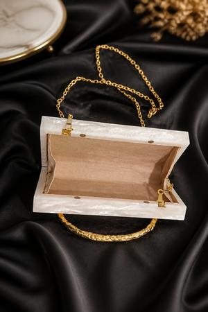 Luxury crystal bunch handle bag with pearl and crystal embellished gold handle and marble finish clutch body