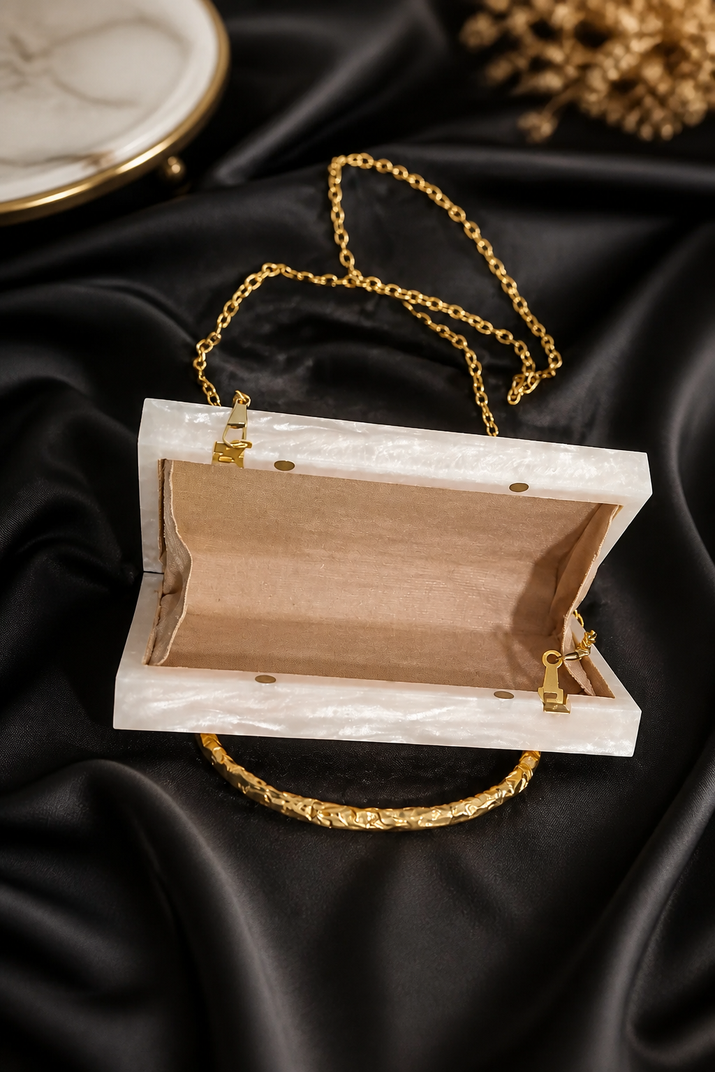 Luxury crystal bunch handle bag with pearl and crystal embellished gold handle and marble finish clutch body