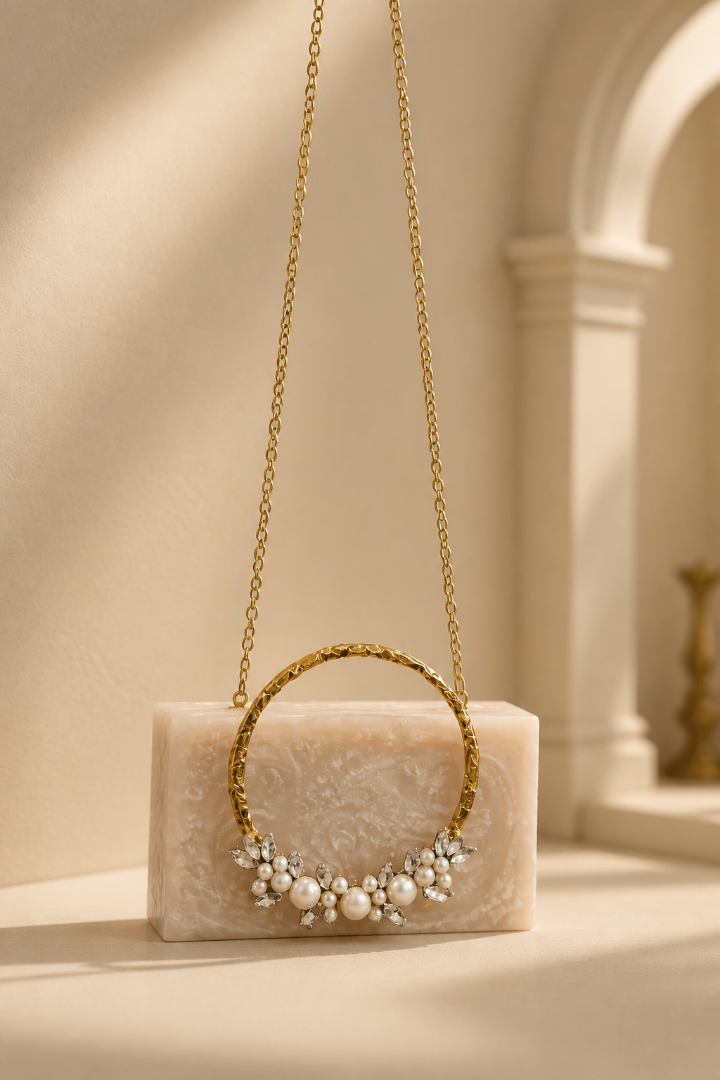 Luxury crystal bunch handle bag with pearl and crystal embellished gold handle and marble finish clutch body