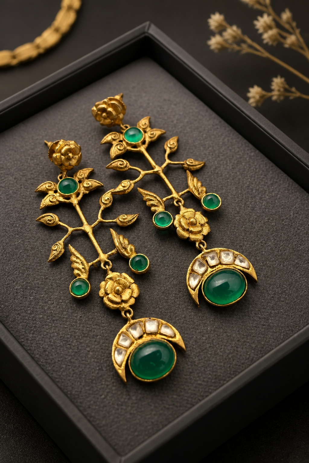 Gold earring with kundan detailing and green onyx stones