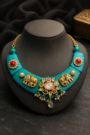 Designer resin necklace with jadau pieces, elephant motifs, kundan detailing, and colourful ethnic stone accents