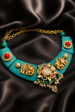 Designer resin necklace with jadau pieces, elephant motifs, kundan detailing, and colourful ethnic stone accents