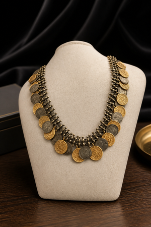 Vintage two tone layered coin necklace with antique metallic detailing and statement ethnic design