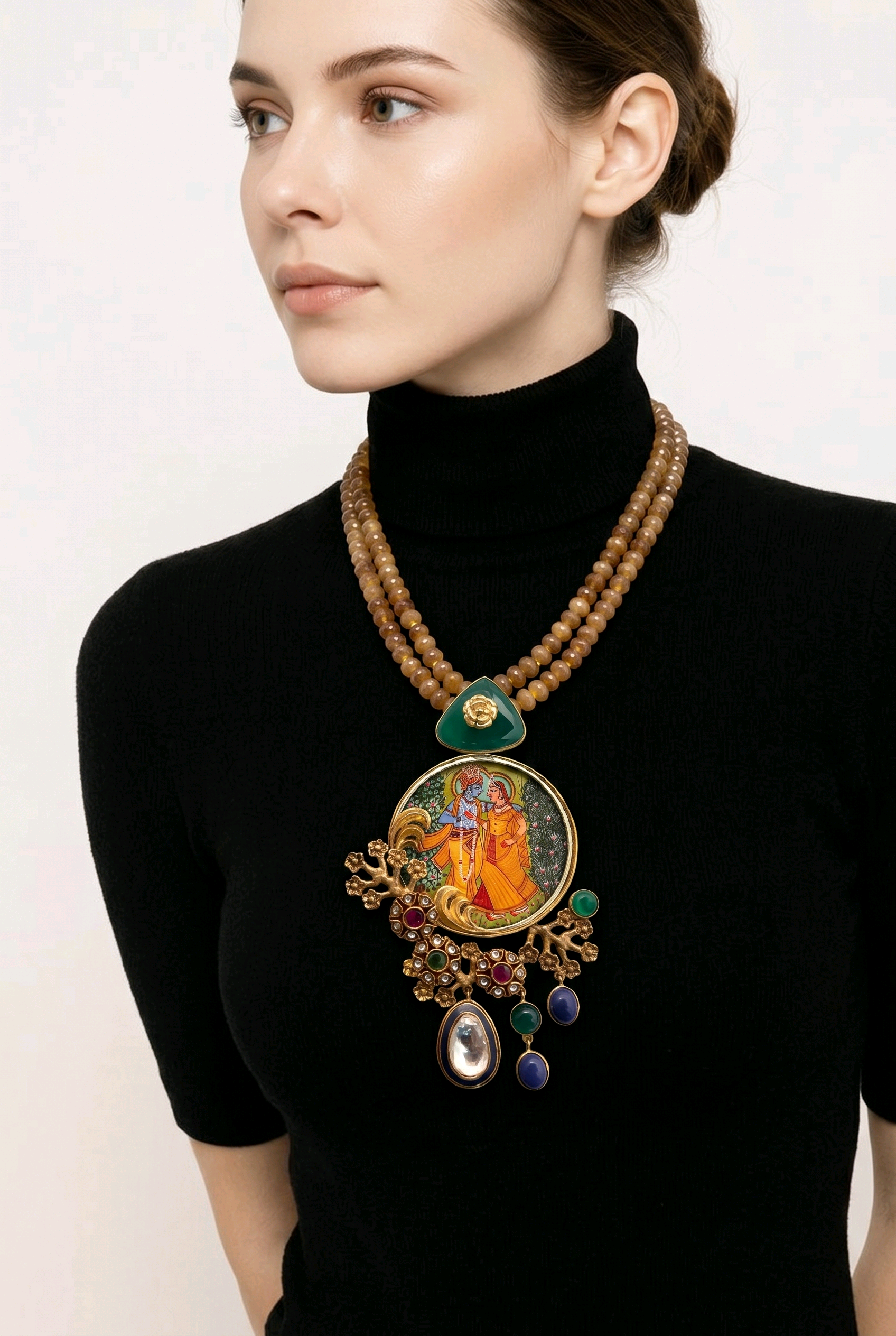 Miniature painting necklace with Radha Krishna artwork, kundan crystal detailing, and brown bead strands in traditional ethnic jewellery style