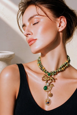 Designer lion motif necklace with kundan crystal detailing and greenish turquoise bead strands in traditional ethnic jewellery style