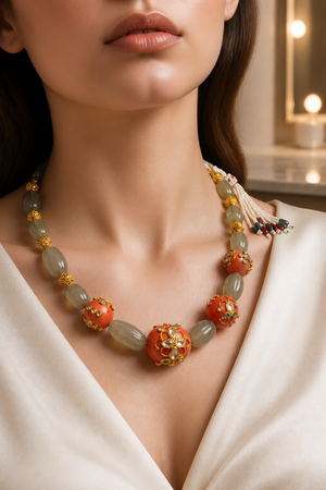 Luxury carved jade stone and coral necklace with intricate jadau work and handcrafted ethnic detailing