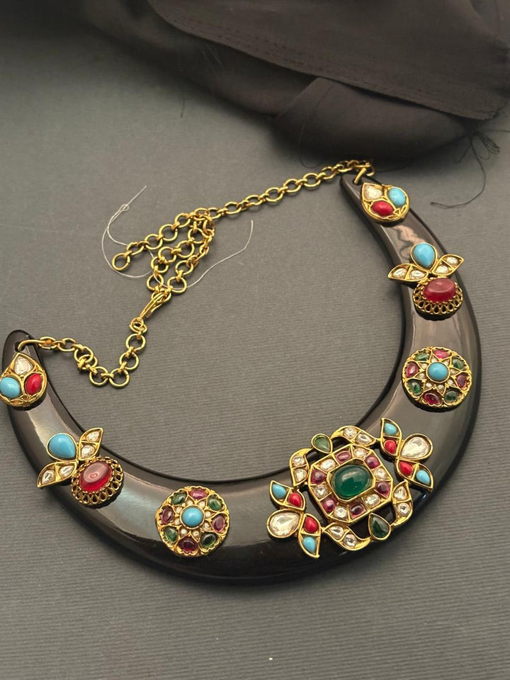 Designer acrylic necklace with colourful jadau pieces and traditional ethnic detailing in statement jewellery style
