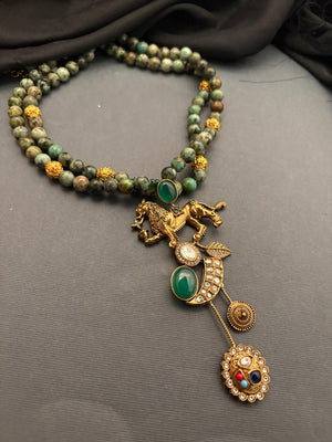 Designer lion motif necklace with kundan crystal detailing and greenish turquoise bead strands in traditional ethnic jewellery style