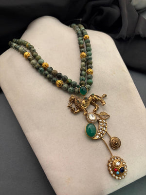 Designer lion motif necklace with kundan crystal detailing and greenish turquoise bead strands in traditional ethnic jewellery style