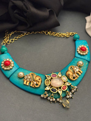 Designer resin necklace with jadau pieces, elephant motifs, kundan detailing, and colourful ethnic stone accents