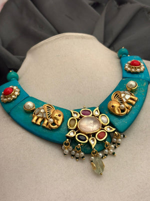 Designer resin necklace with jadau pieces, elephant motifs, kundan detailing, and colourful ethnic stone accents