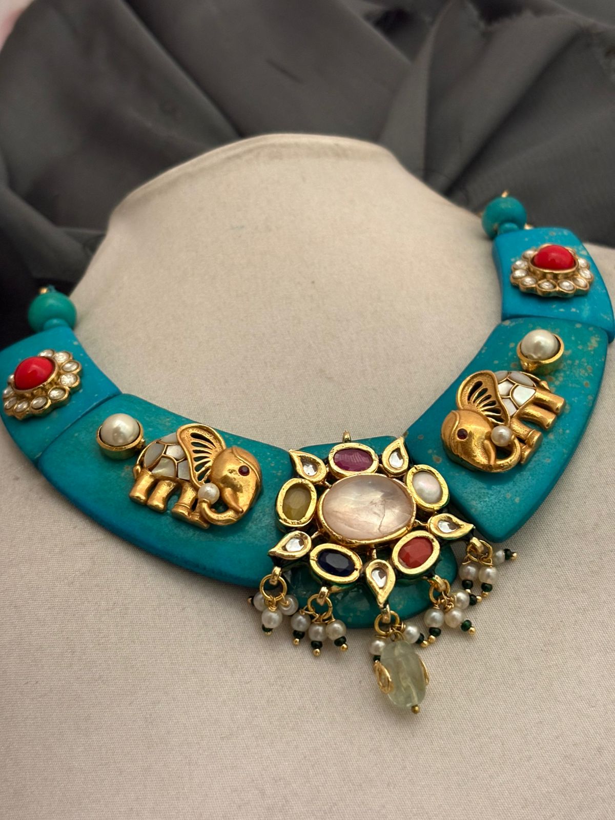 Designer resin necklace with jadau pieces, elephant motifs, kundan detailing, and colourful ethnic stone accents