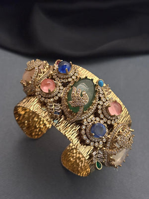 Gold textured ethnic cuff bracelet with coloured stones and AD detailing in traditional designer style
