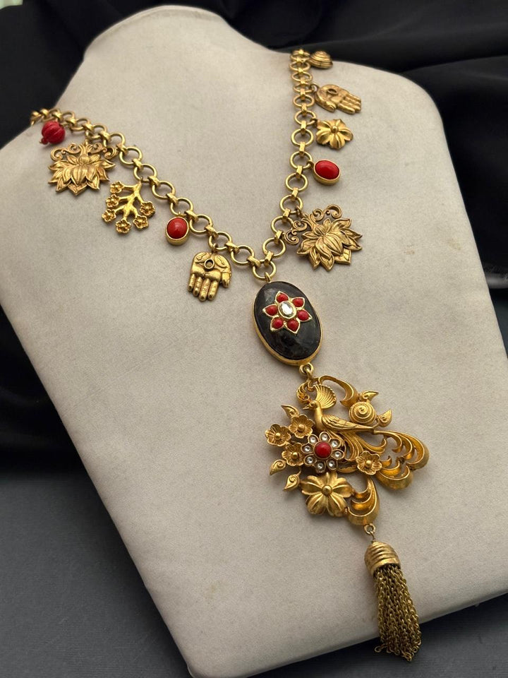 Designer charms style necklace with coral detailing and tassel pendant in traditional ethnic jewellery style
