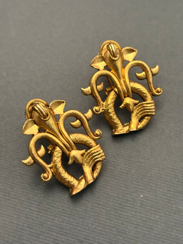Designer gold earrings with contemporary sculpted pattern and elegant ethnic jewellery finish