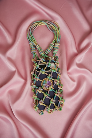 Handcrafted multicolor beaded net bag with intricate boho beadwork and contemporary designer style