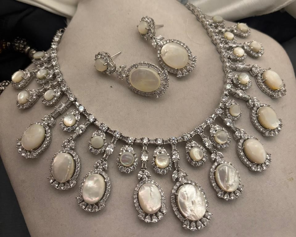 Luxury mother of pearl necklace with sparkling AD detailing and matching earrings in elegant statement jewellery style