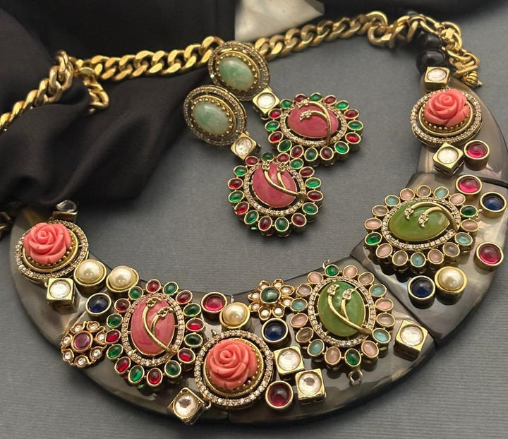 Handcrafted resin necklace with coloured stones, kundan detailing, floral accents, and matching earrings in ethnic statement jewellery style