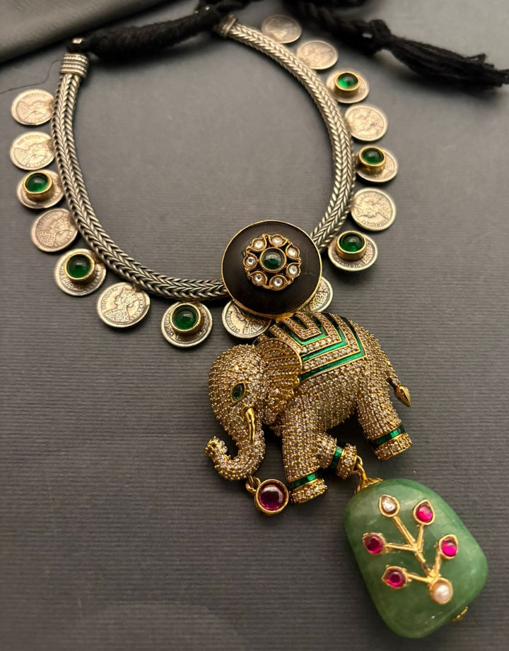 Luxury elephant motif necklace with coin detailing and green jadau stone hanging in traditional ethnic statement design
