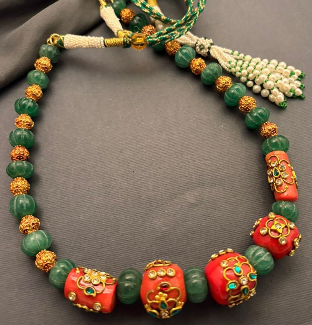Handcrafted green carved beads and coral necklace with intricate jadau work and traditional ethnic detailing