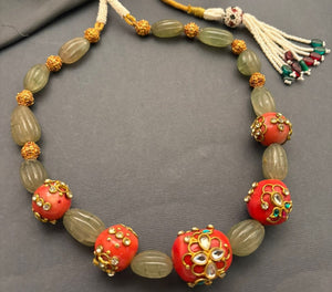 Luxury carved jade stone and coral necklace with intricate jadau work and handcrafted ethnic detailing