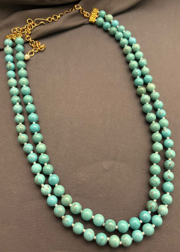 Elegant two line necklace with natural turquoise beads and handcrafted statement jewellery design