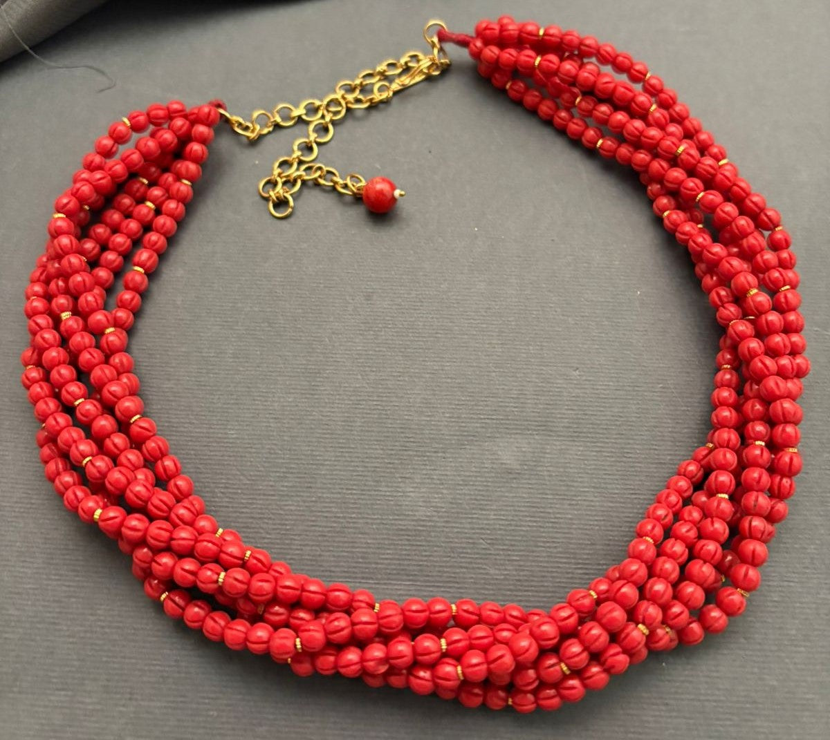 Elegant multi strand small coral beads necklace with handcrafted ethnic statement design