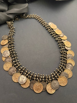 Vintage two tone layered coin necklace with antique metallic detailing and statement ethnic design