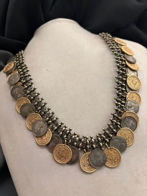 Vintage two tone layered coin necklace with antique metallic detailing and statement ethnic design