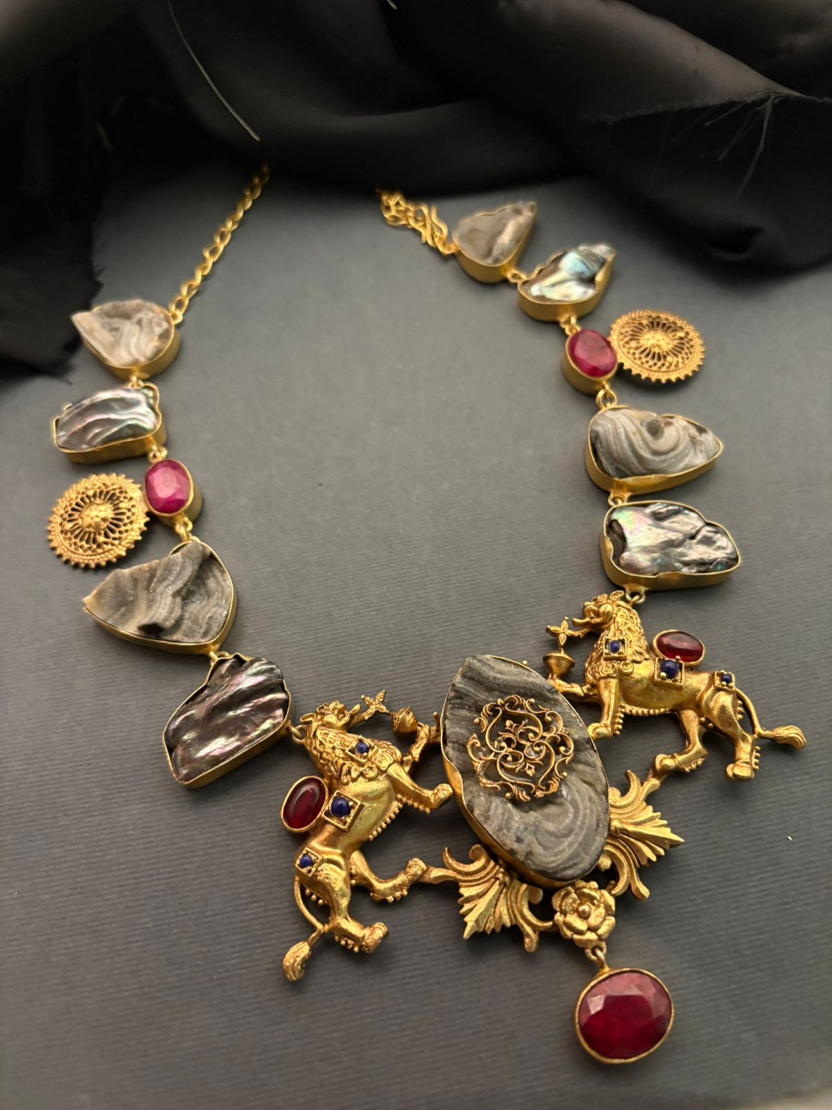 Luxury lion motif necklace with natural agate stones, ruby accents, and intricate handcrafted ethnic detailing