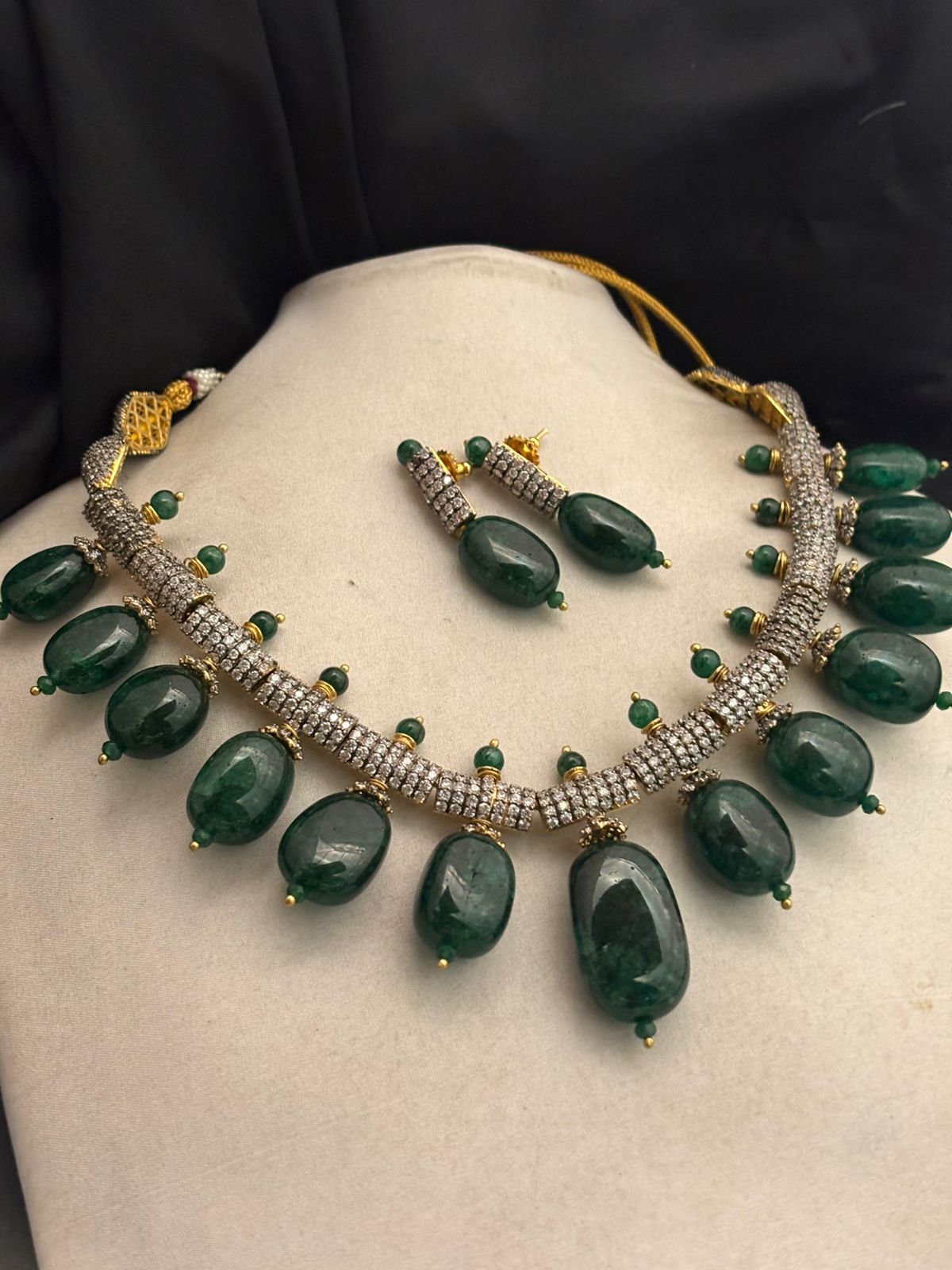 Luxury green tumble stone necklace with sparkling AD detailing and matching earrings in statement ethnic jewellery style