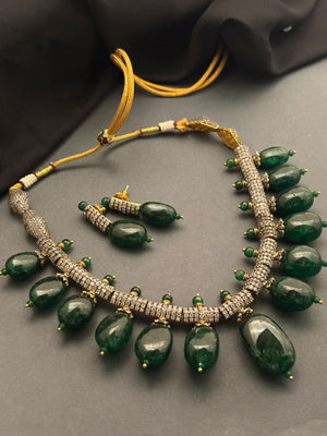 Luxury green tumble stone necklace with sparkling AD detailing and matching earrings in statement ethnic jewellery style