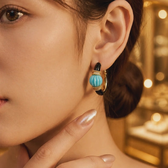 Earring with carved stone with black enamel