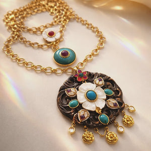 Handcrafted wooden base necklace with mother of pearl floral detailing, turquoise accents, and artistic ethnic statement design
