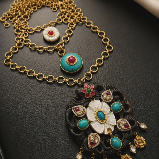 Handcrafted wooden base necklace with mother of pearl floral detailing, turquoise accents, and artistic ethnic statement design