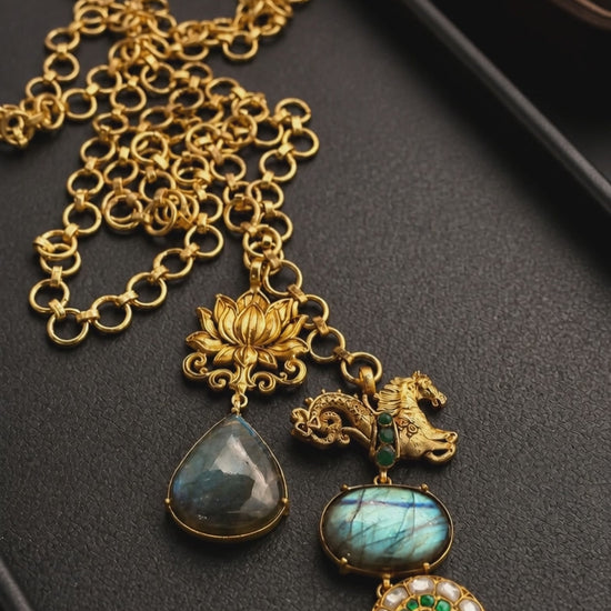 Designer wrap around necklace with labradorite stones and intricate gold motifs in artistic ethnic style