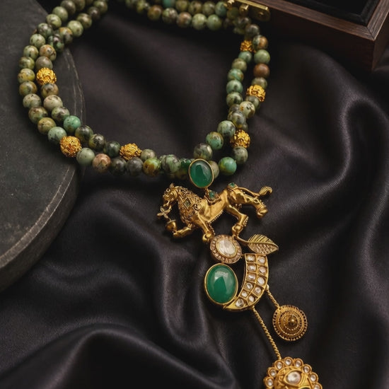 Designer lion motif necklace with kundan crystal detailing and greenish turquoise bead strands in traditional ethnic jewellery style