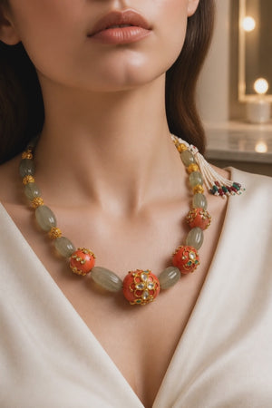 Luxury carved jade stone and coral necklace with intricate jadau work and handcrafted ethnic detailing