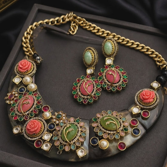 Handcrafted resin necklace with coloured stones, kundan detailing, floral accents, and matching earrings in ethnic statement jewellery style