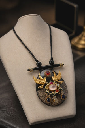 Resin pendant with bird motif and kundan and coloured stones