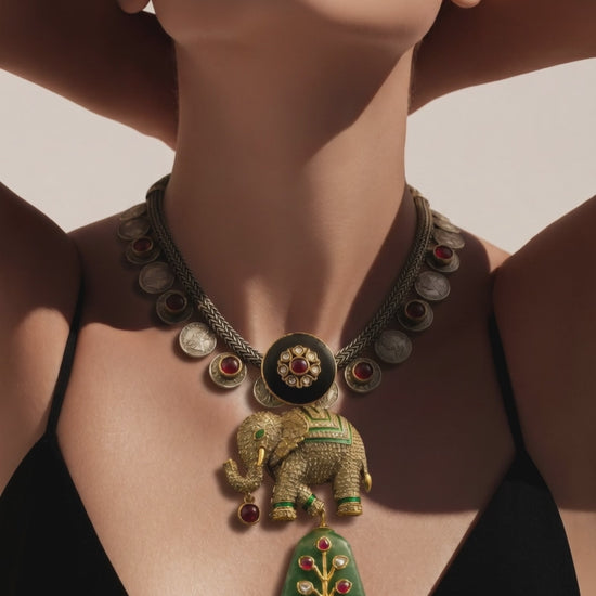 Luxury elephant motif necklace with coin detailing and green jadau stone hanging in traditional ethnic statement design