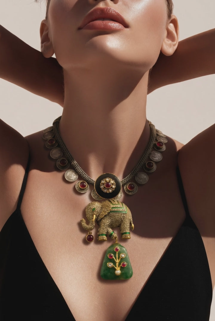 Luxury elephant motif necklace with coin detailing and green jadau stone hanging in traditional ethnic statement design