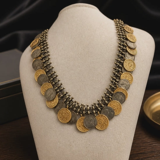 Vintage two tone layered coin necklace with antique metallic detailing and statement ethnic design