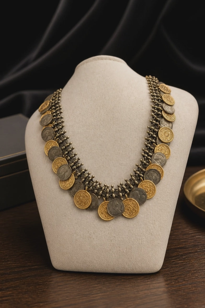Vintage two tone layered coin necklace with antique metallic detailing and statement ethnic design