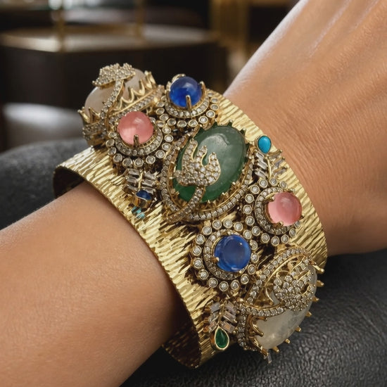 Gold textured ethnic cuff bracelet with coloured stones and AD detailing in traditional designer style