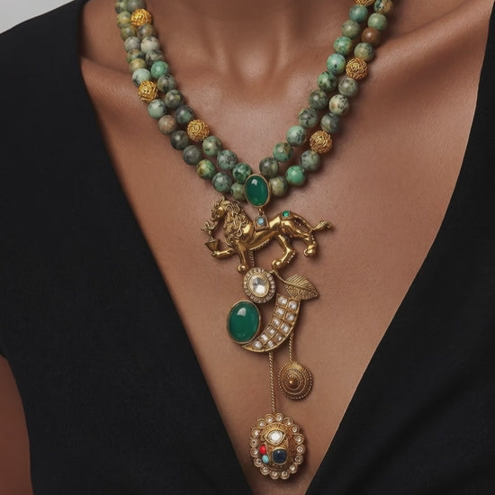 Designer lion motif necklace with kundan crystal detailing and greenish turquoise bead strands in traditional ethnic jewellery style